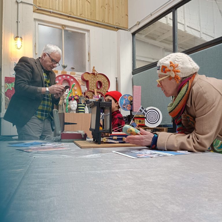 People playing with the games and automata at the exhibtion