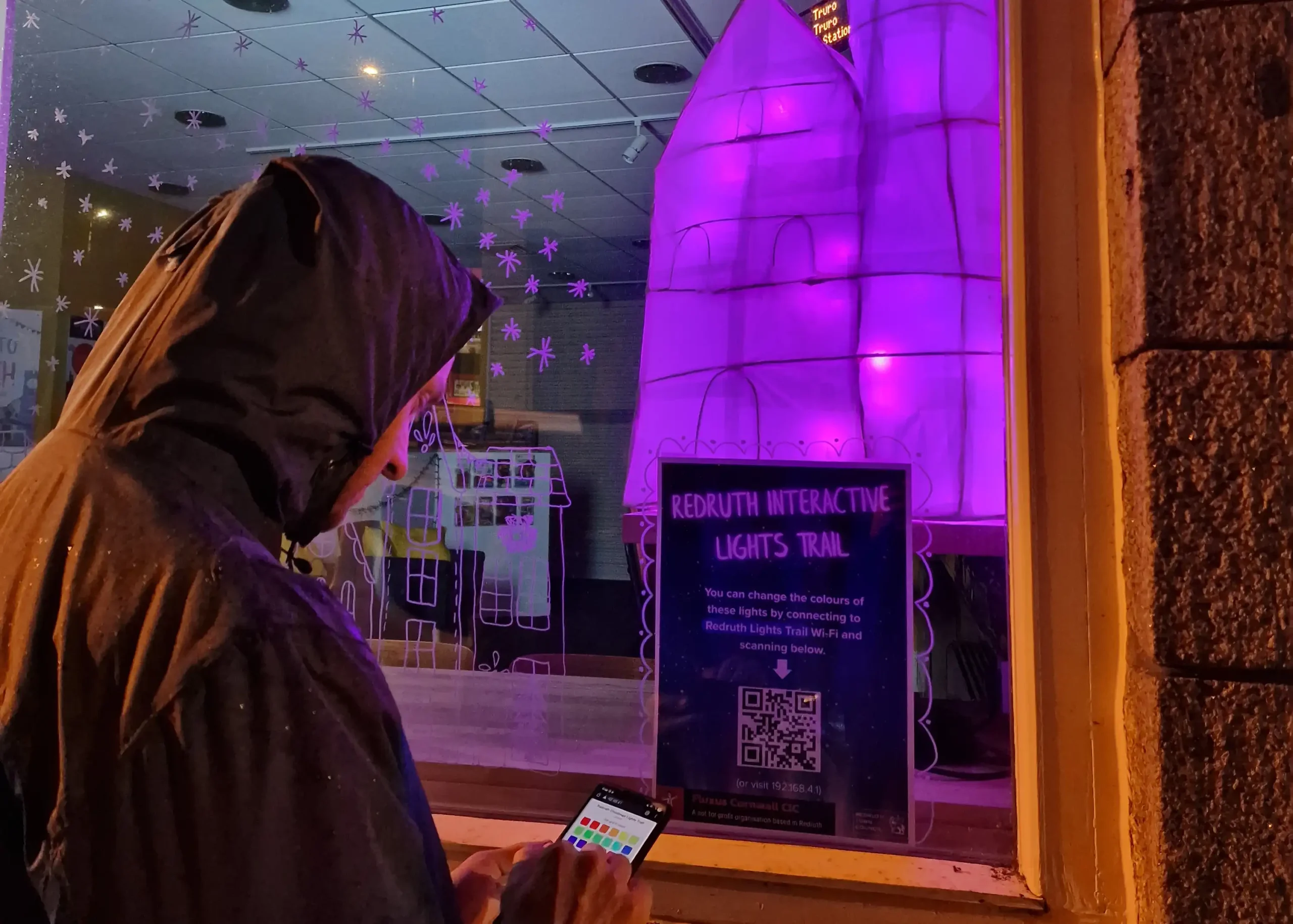 interactive christmas lights trail in the library window